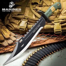 Tactical knife with serrated blade on a military gear background