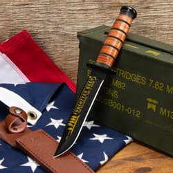 USMC knife with engraved blade on a military-themed background
