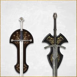 Two swords mounted on decorative plaques with intricate designs