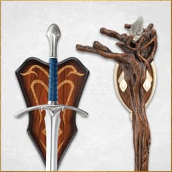 Close-up of sword and staff mounted on wooden plaques