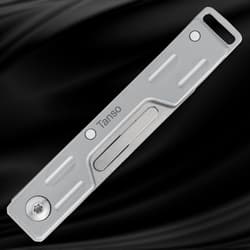 Closed silver folding knife on black background