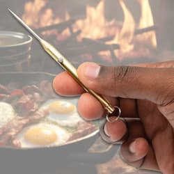 Gold Titanium Spring Toothpick in hand