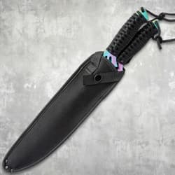 Machetes in a black nylon sheath on a textured background