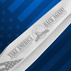 Close-up of knife blade with engraved text and design