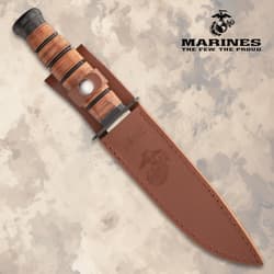 Knife sheathed in brown leather with USMC logo