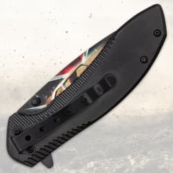 Closed folding knife with black handle and clip