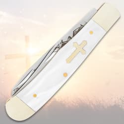Closed pocket knife with cross design on handle