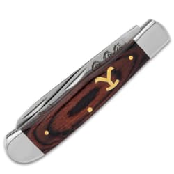 The handle scales are wooden with an inset brass “Y brand”