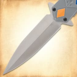 Close-up of a knife blade on a textured background