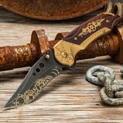 Steampunk knife on rustic wood and metal surface