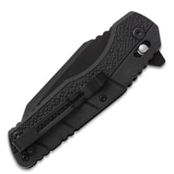 Closed black folding knife with pocket clip