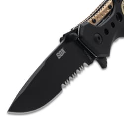 Close-up of black serrated knife blade
