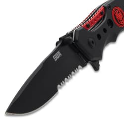 Close-up of black serrated knife blade