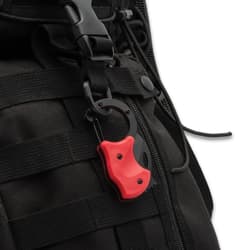 Red RaptorClip attached to backpack