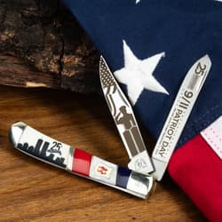 Knife with 9/11 design on wooden surface and American flag