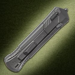 Closed Smith & Wesson knife on textured background