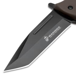 The USMC Tanto Maximum Pocket Knife is shown closed with TPR handle that has the iconic stacked USMC handle style.