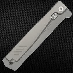 Closed folding knife with metal clip on textured surface