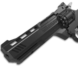 Close-up of black air pistol barrel with warning text