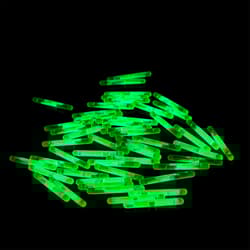 Pile of green glow sticks on a black background