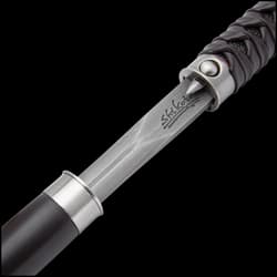 The handle has a brown wooden knob and is wrapped, Samurai sword-style, in faux rayskin and genuine brown leather