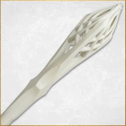 Close-up of the top part of a white staff with lattice design