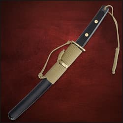 Sheathed tanto with paracord wrap on red background