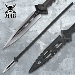 Close-up of black spear with silver blade and sheath