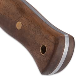 Richly veined zebra wood handle scales are securely fastened to the tang with brass pins and the handle features a brass lanyard hole