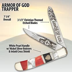 Knife with Christian-themed etching and detailed handle