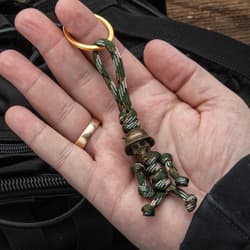 Full image of the Trooper Pendant Keychain held in hand connected to a keychain.