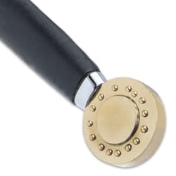 The handle is steel with a genuine black leather grip and a brass medallion-style pommel with raised decoration