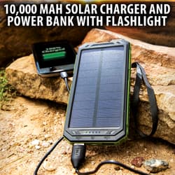 Solar charger and power bank with flashlight charging a phone