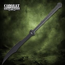 Black sword with angled blade and textured handle on green background