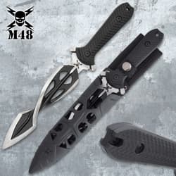 M48 Tsunami dagger with sheath on a textured surface