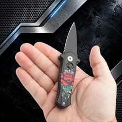 Small knife with rose design held in hand