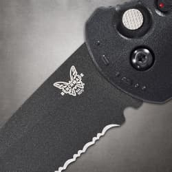 Close-up of serrated blade with Benchmade logo