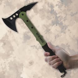 Hand holding a USMC tactical tomahawk