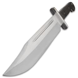 Angled view of a large silver bowie knife with a large thick steel handguard.