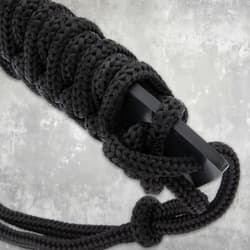 Close-up of black cord-wrapped handle on machete