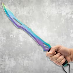 Hand holding a rainbow titanium machete with black handle