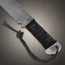 Close-up of machete handle with wrapped grip