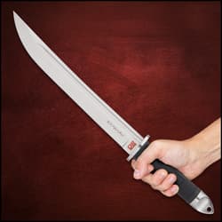 It has a massive, thick, 10 3/4”, full-tang D2 tool steel blade with a deep blood groove that spans the entire length of blade