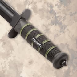 Close-up of USMC knife handle with textured grip