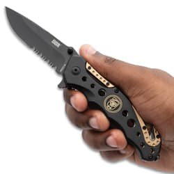 Hand holding black and tan folding knife