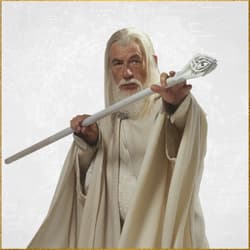 Gandalf in white robes holding a detailed staff