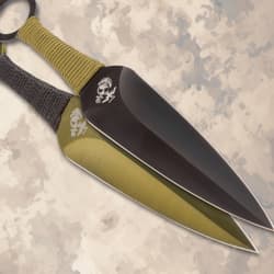 Close-up of two USMC throwing knives with cord grips