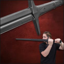Person in black shirt holding a training sword, close-up of hilt