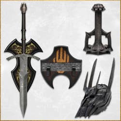 Medieval sword, shield, and helmet with intricate designs on a wooden chest