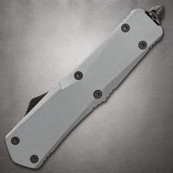 Closed tactical knife showing screws and handle texture